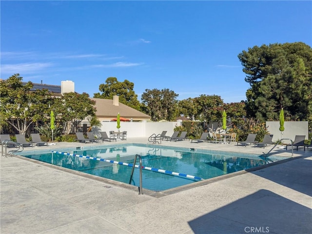 view of swimming pool with a patio