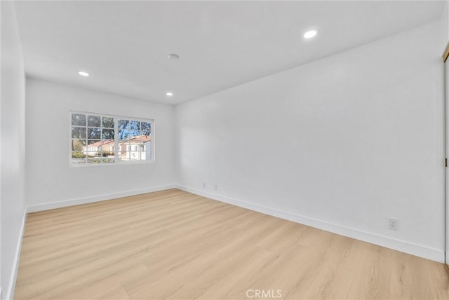 unfurnished room featuring light hardwood / wood-style flooring