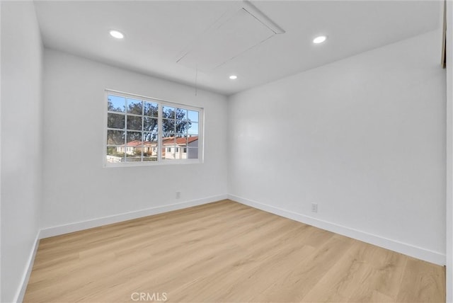 unfurnished room featuring light hardwood / wood-style floors