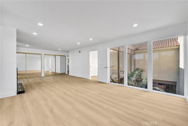 basement with light hardwood / wood-style floors