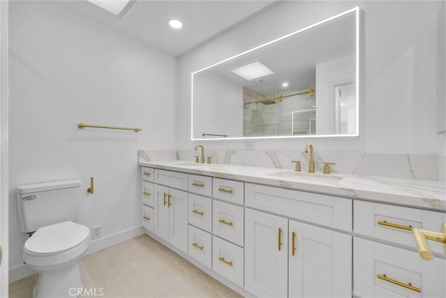 bathroom featuring toilet, vanity, tile patterned floors, and walk in shower