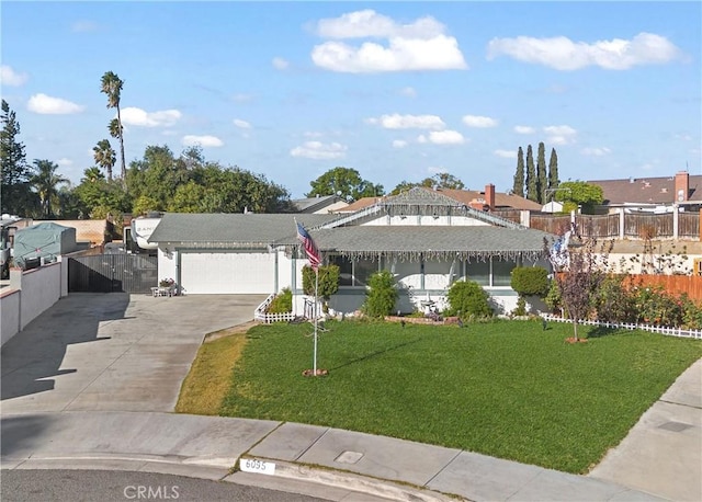 view of front of house with a garage and a front yard