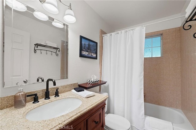 full bathroom featuring toilet, vanity, and shower / bath combination with curtain