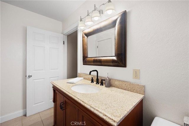 bathroom with vanity and tile patterned flooring