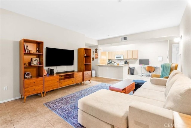 living room with light tile patterned floors