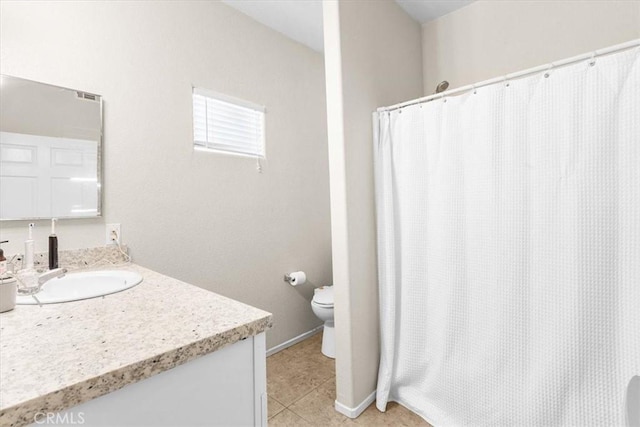 bathroom featuring toilet, a shower with curtain, tile patterned floors, and vanity