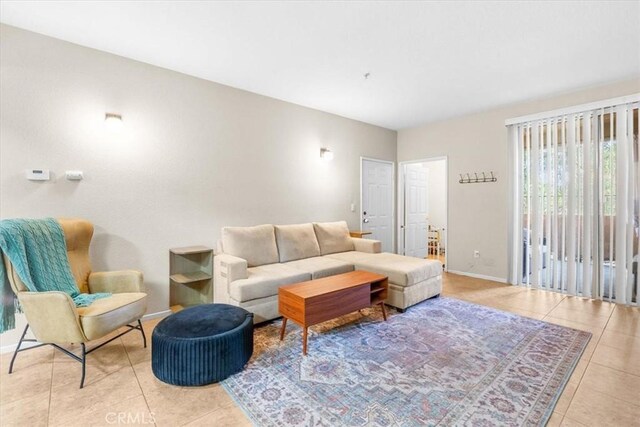 living room with light tile patterned flooring