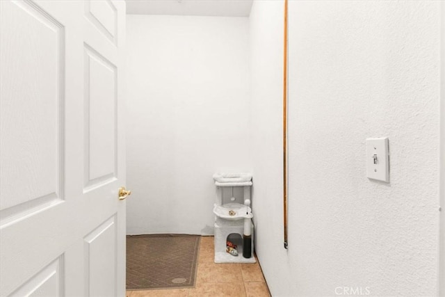 bathroom with tile patterned flooring