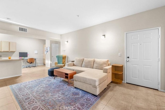 living room with light tile patterned floors