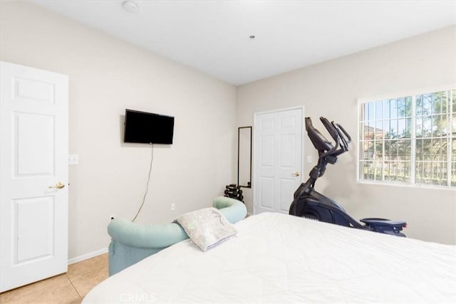 bedroom featuring light tile patterned flooring