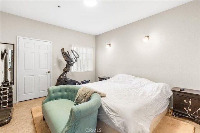 bedroom with light tile patterned floors