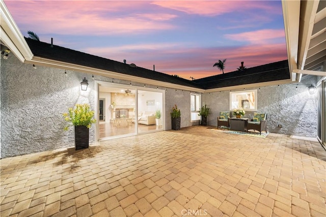 view of patio terrace at dusk