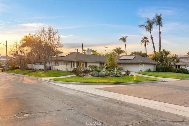 ranch-style house with a yard