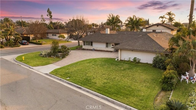 ranch-style house with a lawn