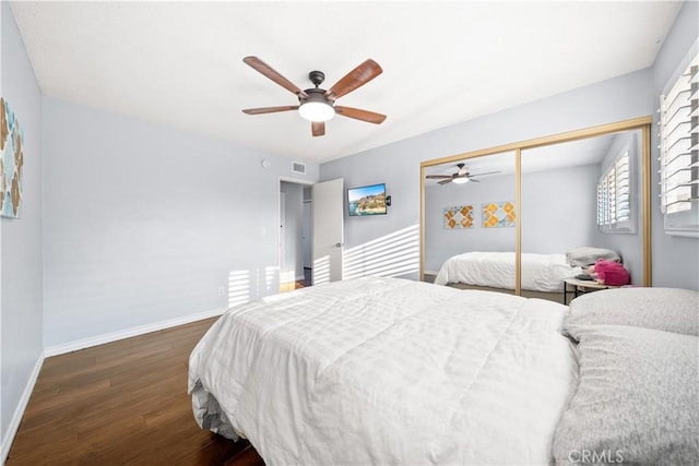 bedroom featuring ceiling fan, a closet, and dark hardwood / wood-style floors