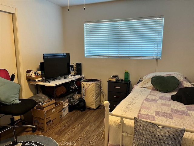 bedroom featuring dark hardwood / wood-style floors