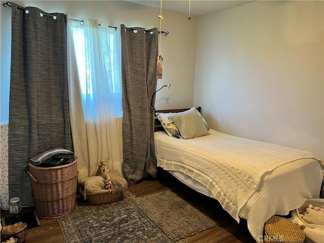 bedroom featuring hardwood / wood-style flooring