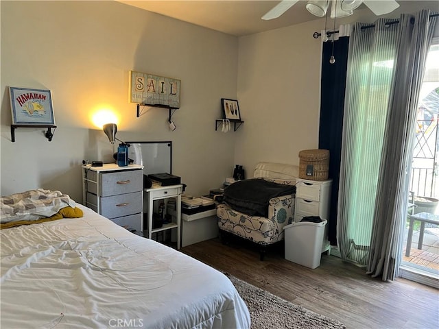 bedroom with ceiling fan, multiple windows, and hardwood / wood-style floors