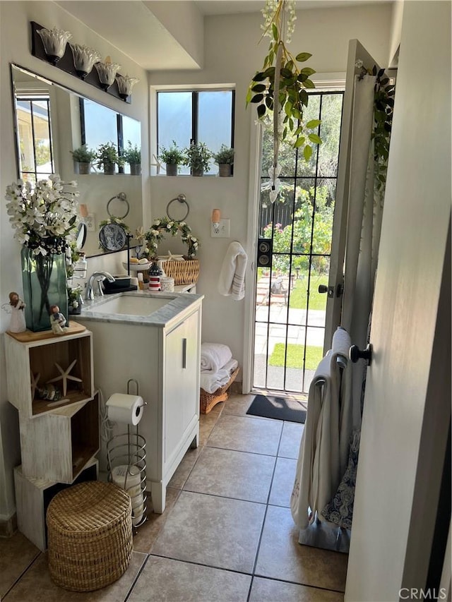 bathroom with tile patterned flooring and sink