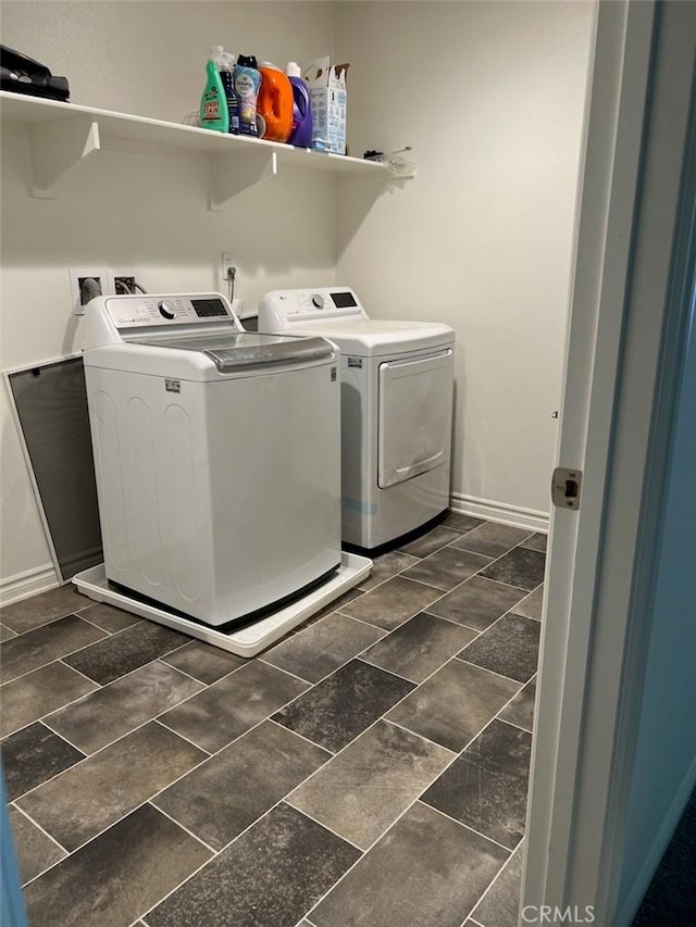 clothes washing area with washing machine and clothes dryer