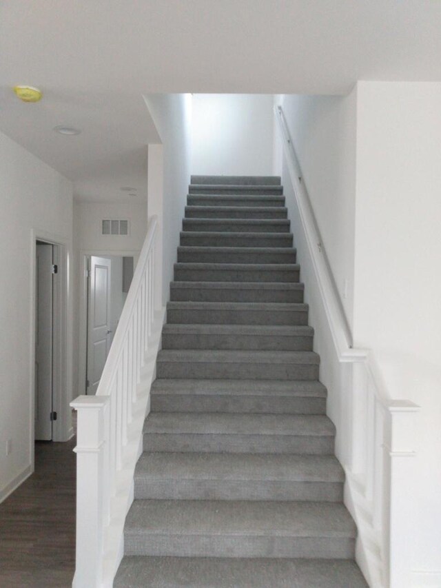 stairway with wood-type flooring