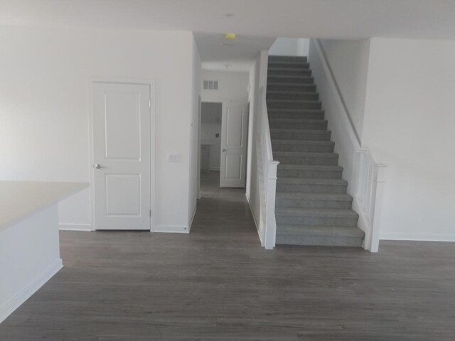 staircase featuring hardwood / wood-style floors