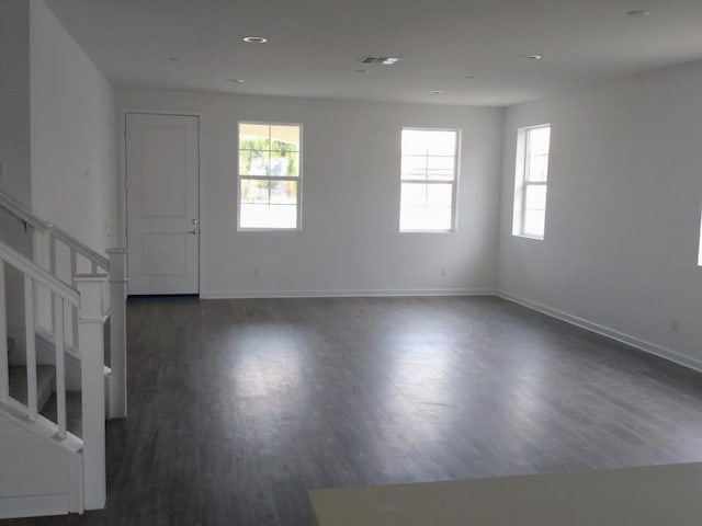 empty room featuring dark wood-type flooring