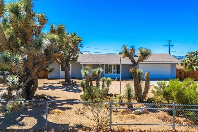 view of front of property with a garage