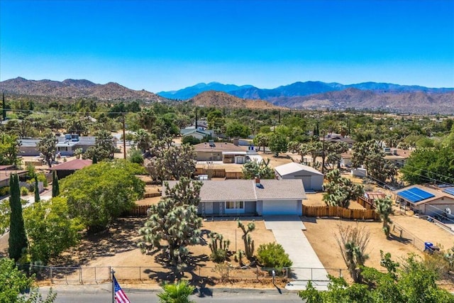 birds eye view of property featuring a mountain view