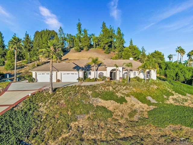 ranch-style home featuring a garage