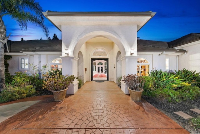 exterior entry at dusk with french doors