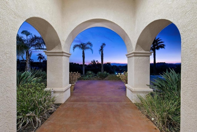 view of patio terrace at dusk