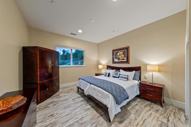 bedroom with recessed lighting, visible vents, and baseboards