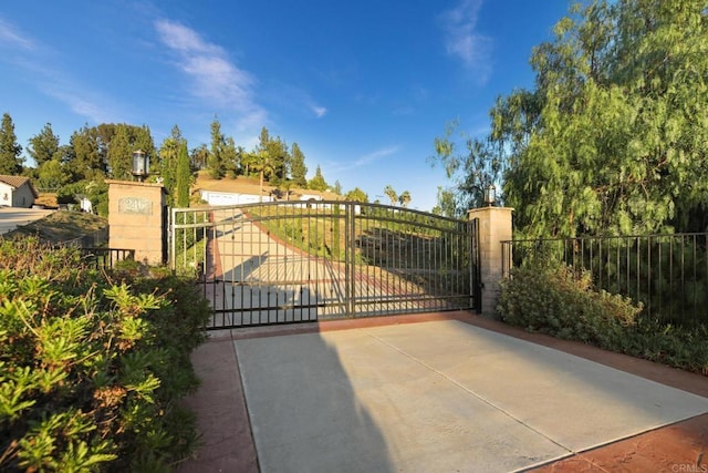 view of gate with fence