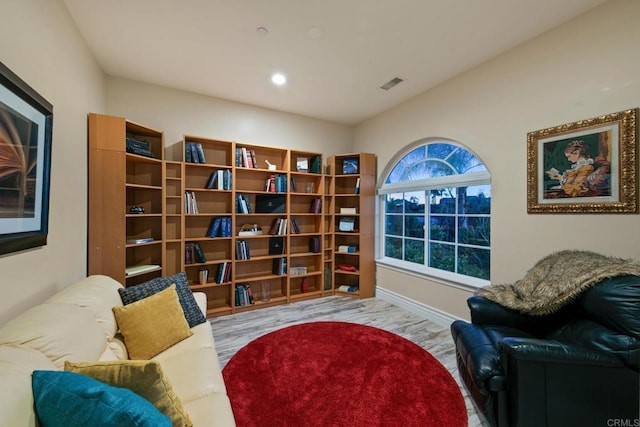 sitting room with baseboards, visible vents, and recessed lighting