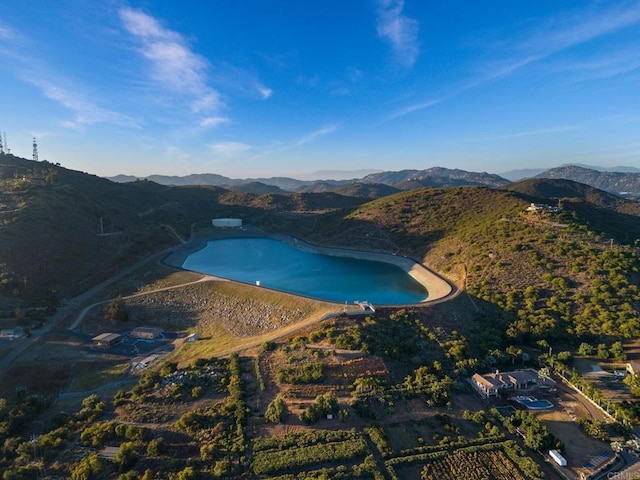 bird's eye view with a water and mountain view