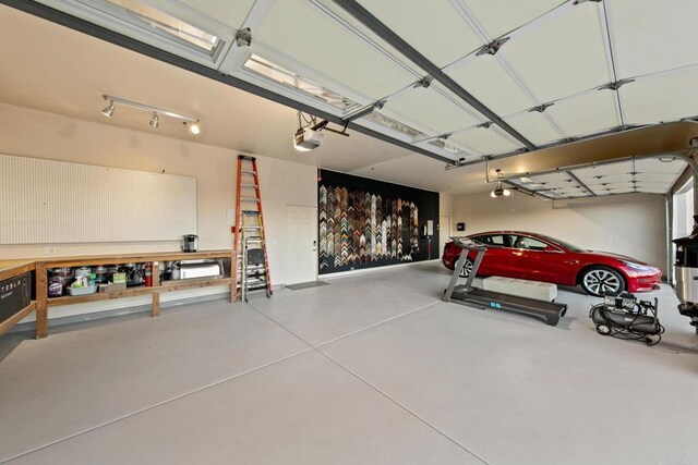 246 Yucca, Fallbrook, CA 92028 - garage with a garage door opener and a workshop area