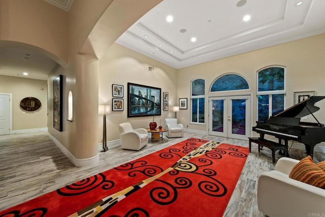 246 Yucca, Fallbrook, CA 92028 - living area featuring arched walkways, wood finished floors, french doors, ornamental molding, and baseboards