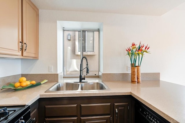 kitchen featuring dark brown cabinets, sink, light brown cabinetry, and black appliances