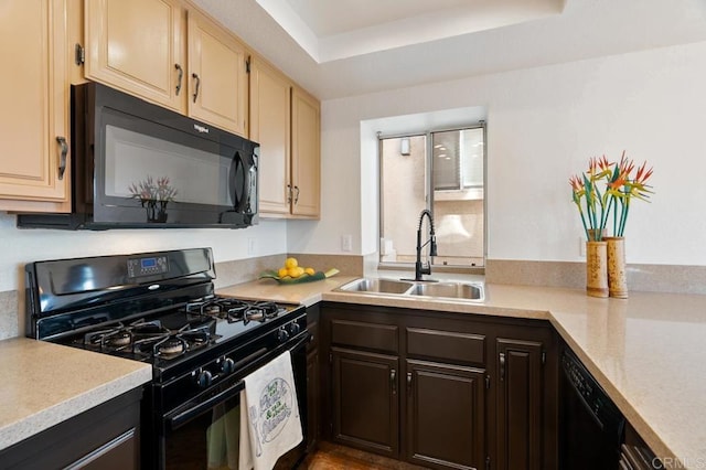 kitchen with sink, black appliances, dark brown cabinets, a raised ceiling, and cream cabinetry