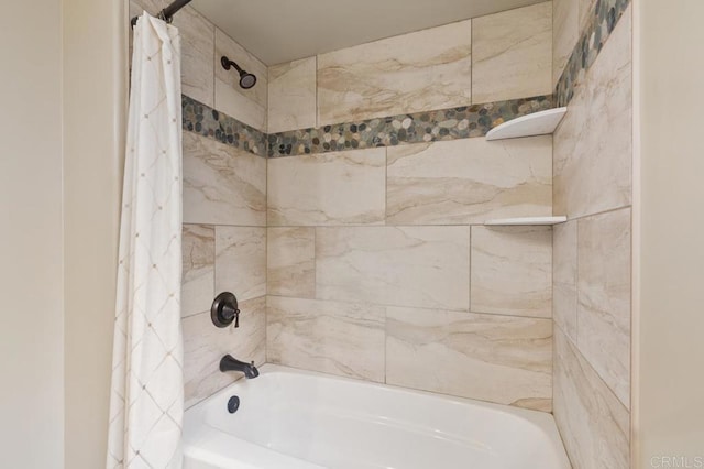 bathroom with shower / tub combo with curtain