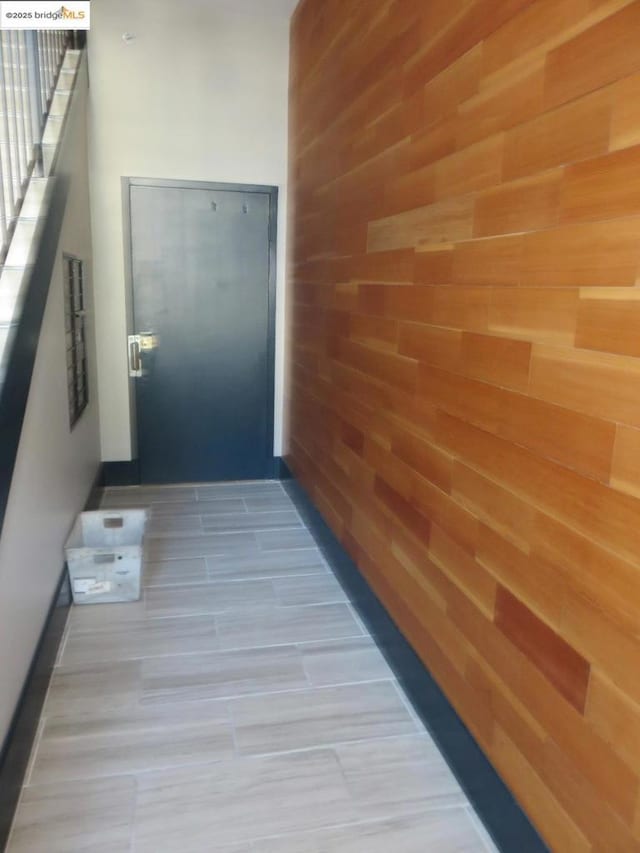 hallway with wooden walls