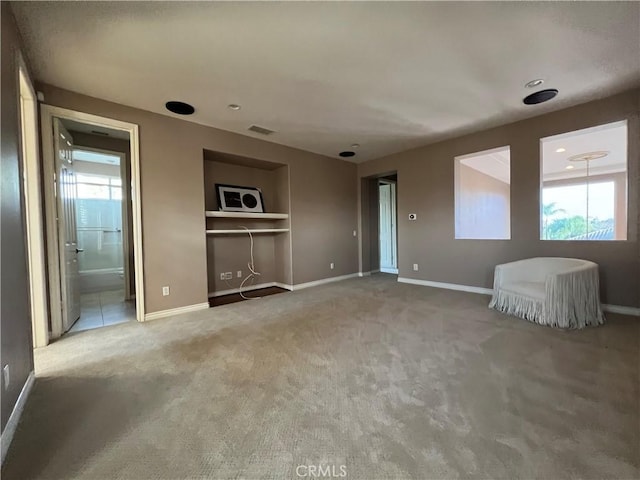 interior space featuring carpet and built in shelves