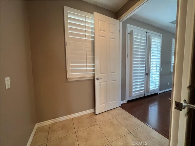 tiled entrance foyer featuring a wealth of natural light