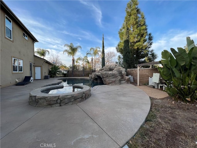 view of patio / terrace featuring a fenced in pool