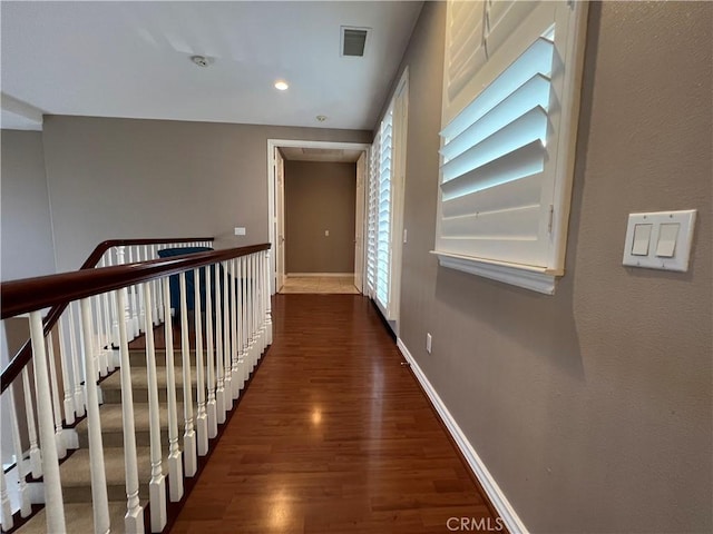 hall with dark hardwood / wood-style floors