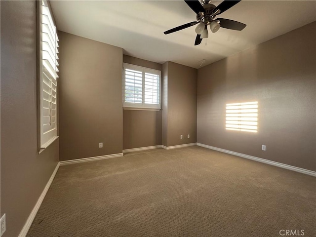 unfurnished room with carpet floors and ceiling fan