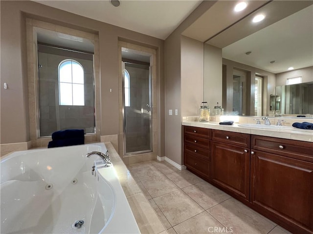 bathroom with tile patterned flooring, separate shower and tub, and vanity