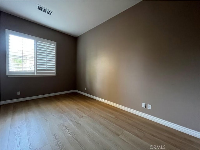 empty room with light wood-type flooring