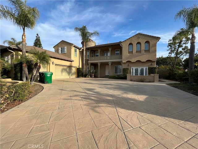 mediterranean / spanish house featuring a garage